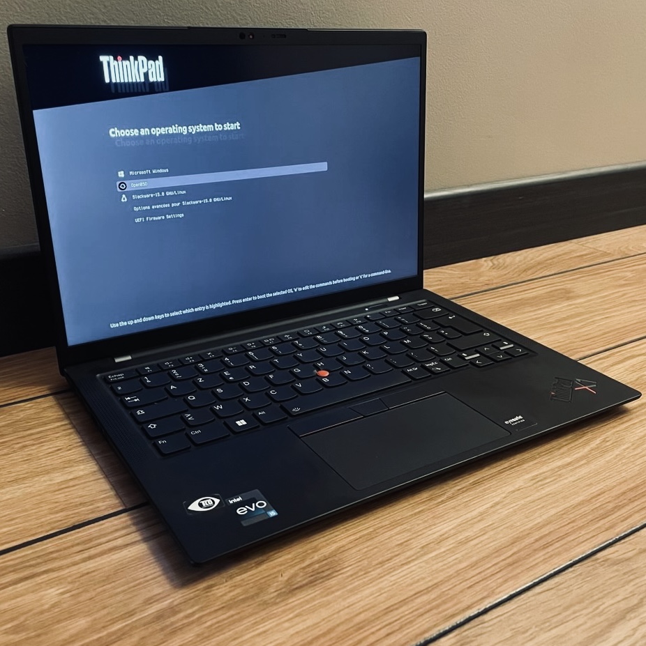 A ThinkPad X1 Carbon Gen 10 with Grub ready to launch Windows, OpenBSD or Slackware Linux